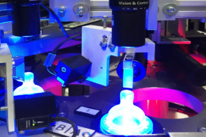 Automated vision inspection system using blue LED lighting for part verification