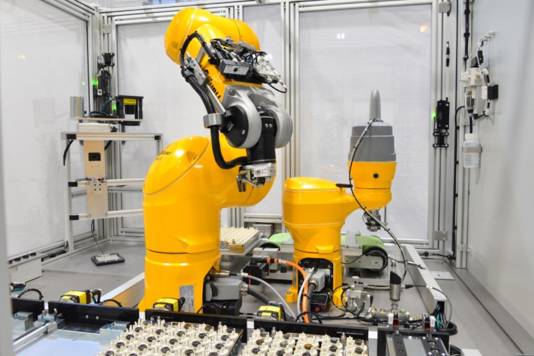 Industrial robot performing precision lapping and component finishing inside automated machine