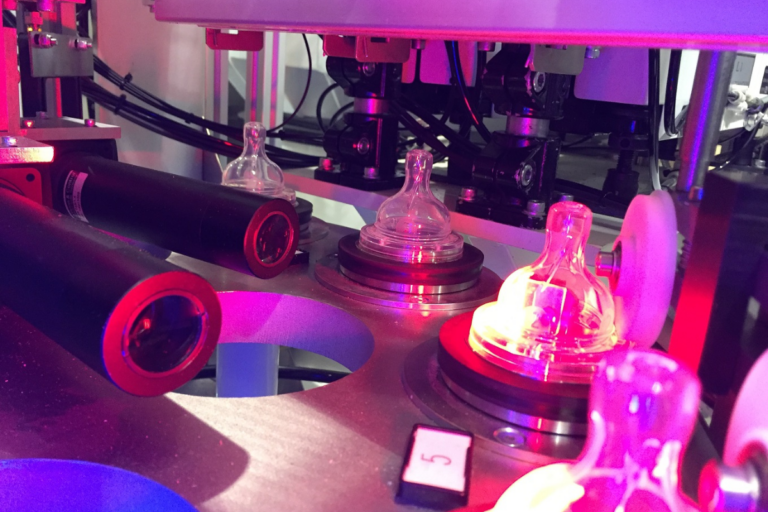 Vision inspection system using LED lighting to inspect components on an automated production line