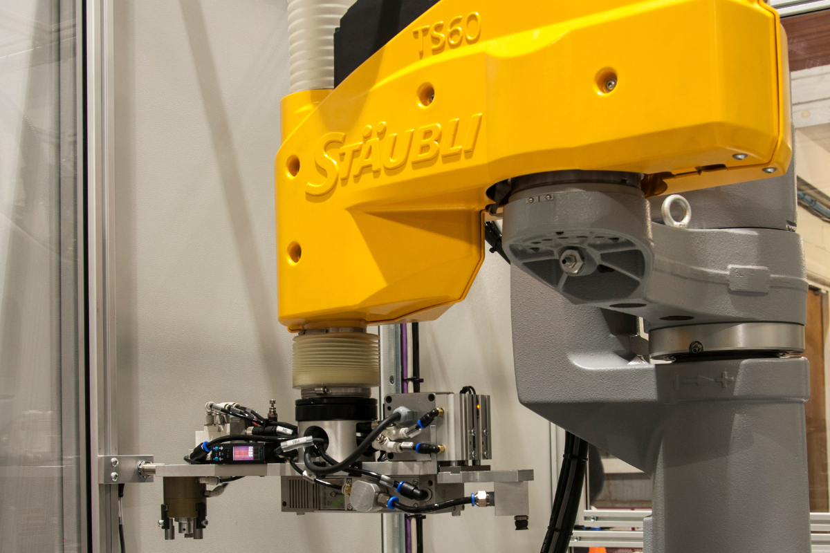 Integrated robotic handling system with vision inspection and automated process control in manufacturing