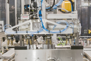 Automated component pressure testing system with multi-point test heads and controlled hydraulic pressure generation