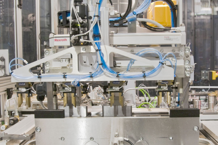 Automated component pressure testing system with multi-point test heads and controlled hydraulic pressure generation