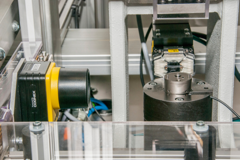Cognex vision camera integrated into a bespoke hydraulic leak testing machine for automated component inspection.
